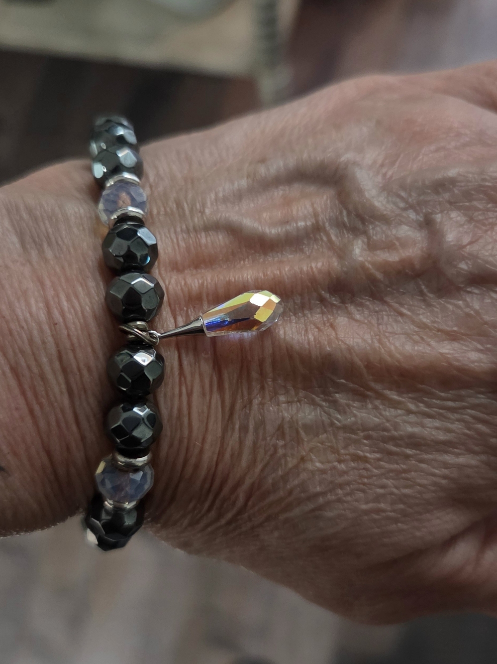 Faceted Hematite Bead Bracelet with Iridescent Teardrop Charm